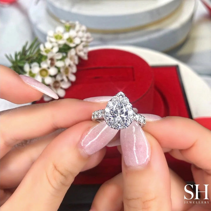 Bold Pear Shaped Halo & Pavé-Set Diamond Band - W0578