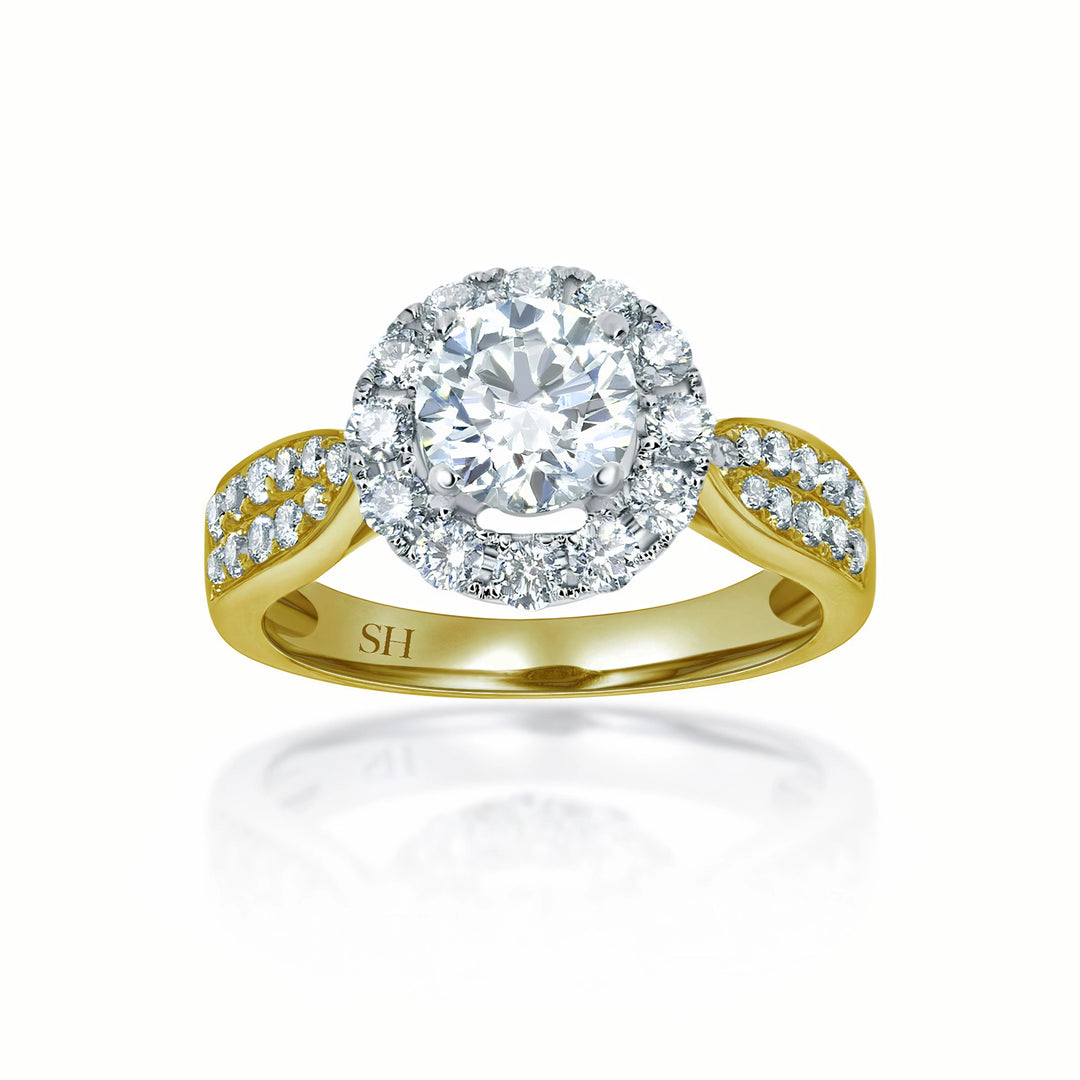 Halo style engagement ring with tapered pavé set diamond band - W0040