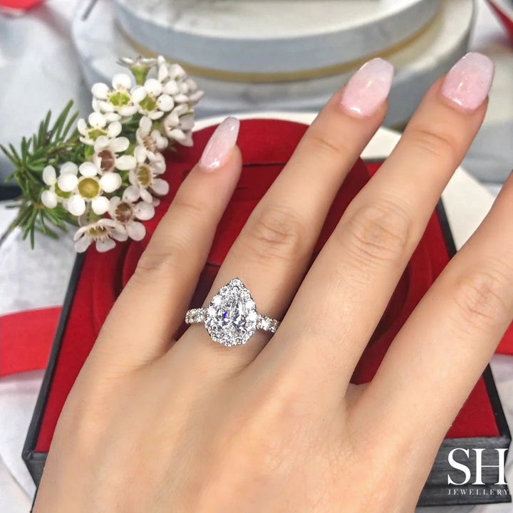 Bold Pear Shaped Halo & Pavé-Set Diamond Band - W0578